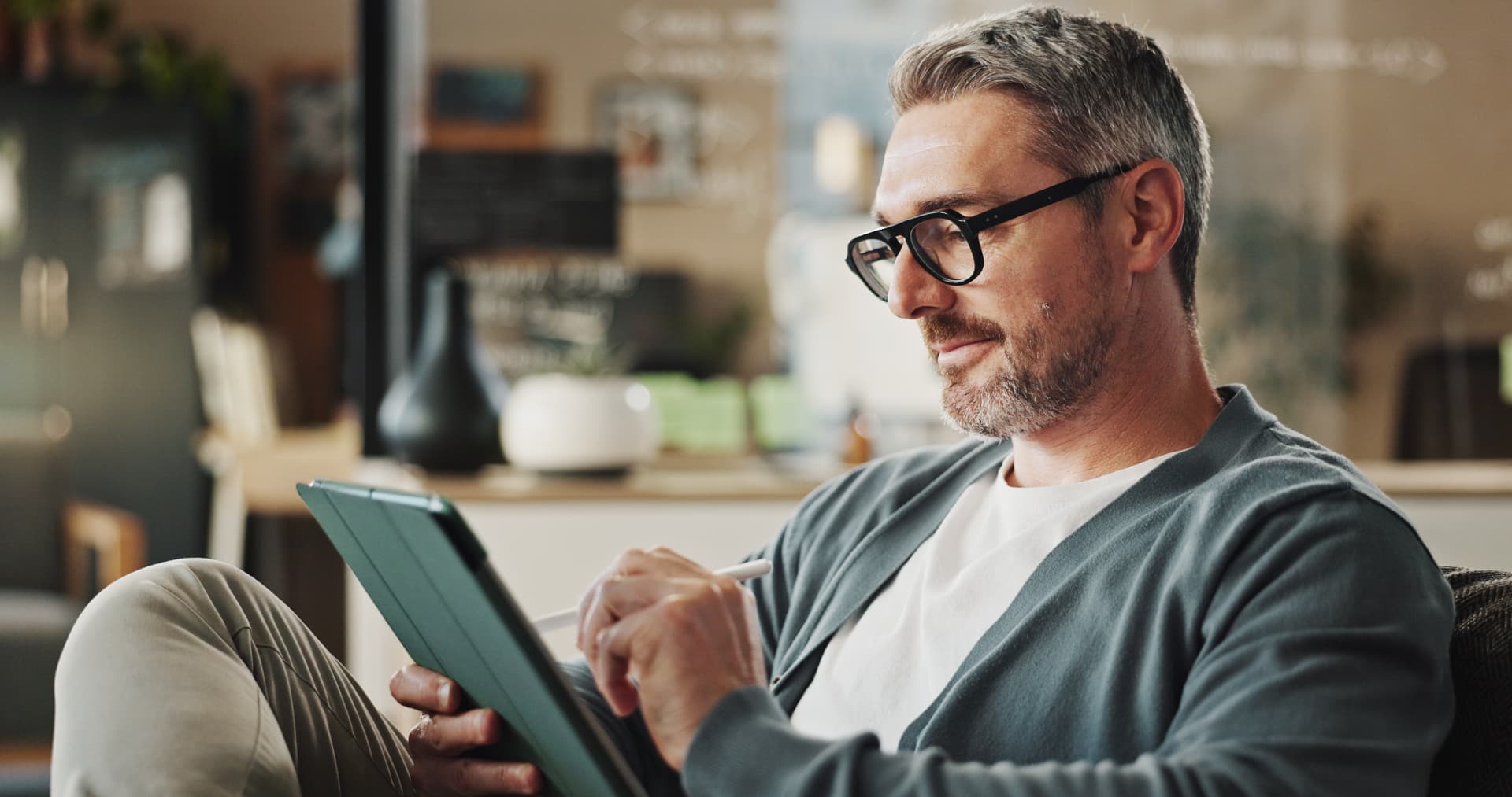 Business owner reviewing financial guides on a tablet