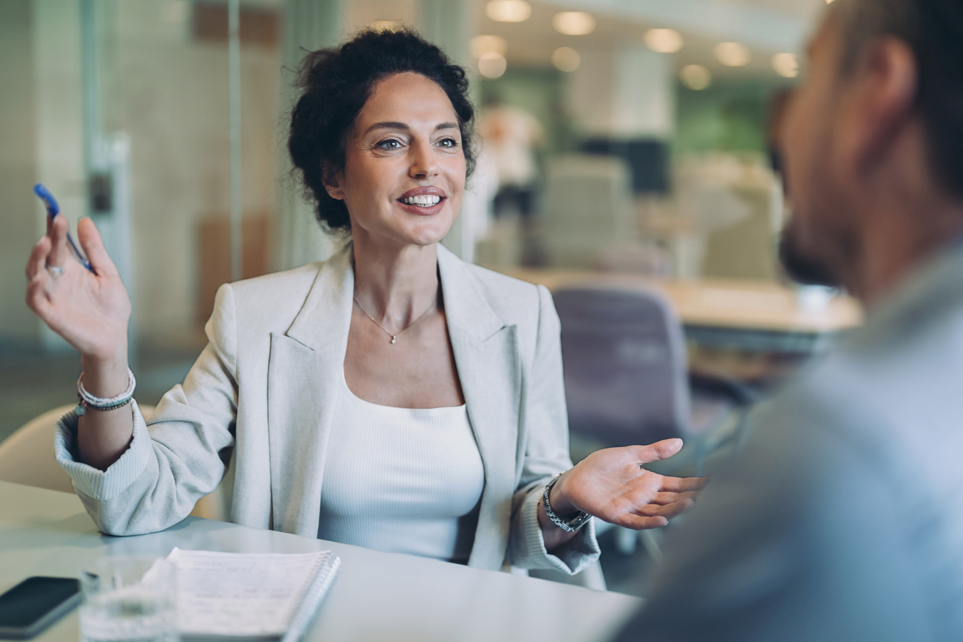 An experienced advisor and business owner reviewing financial documents together