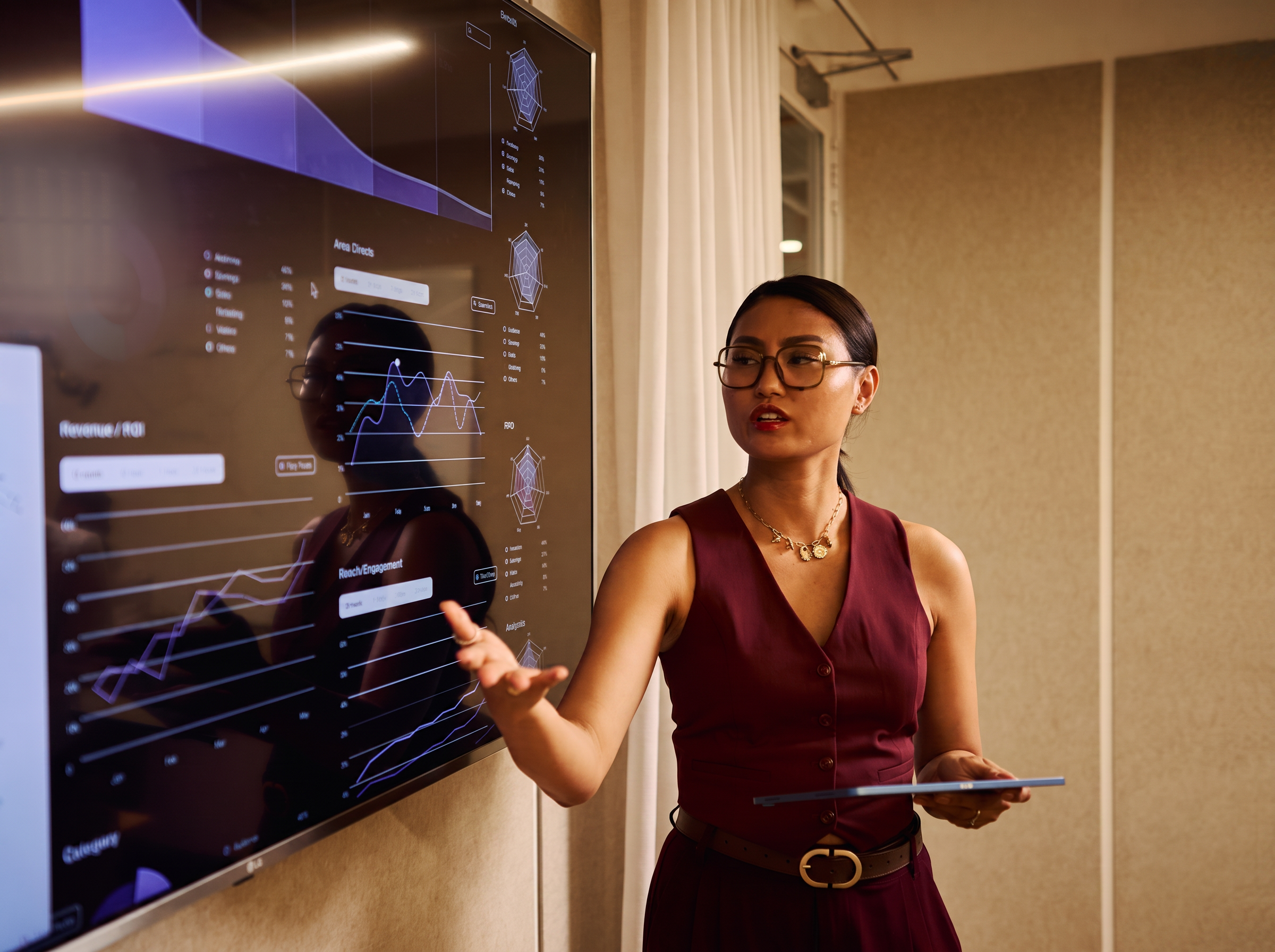 A professional presenting financial data on a large screen